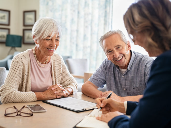 senior couple meeting with medicare agent